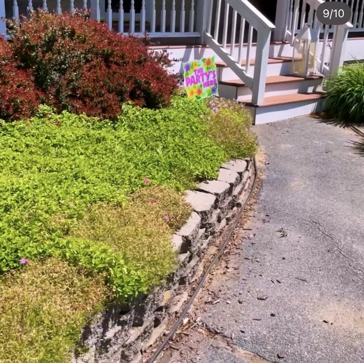 Front planting bed and stone border beside porch steps
